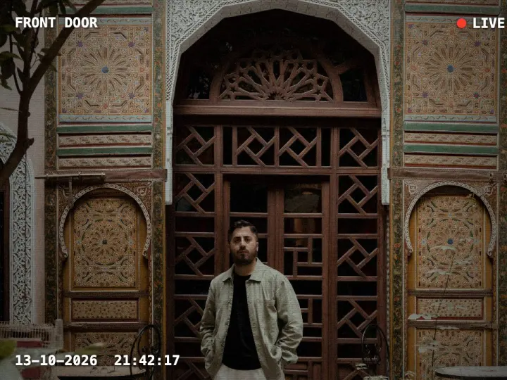 A visitor in front of the door, seen live